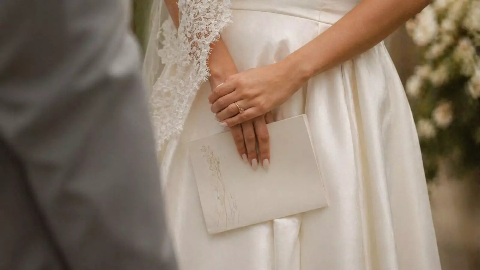 bride holding wedding vows letter