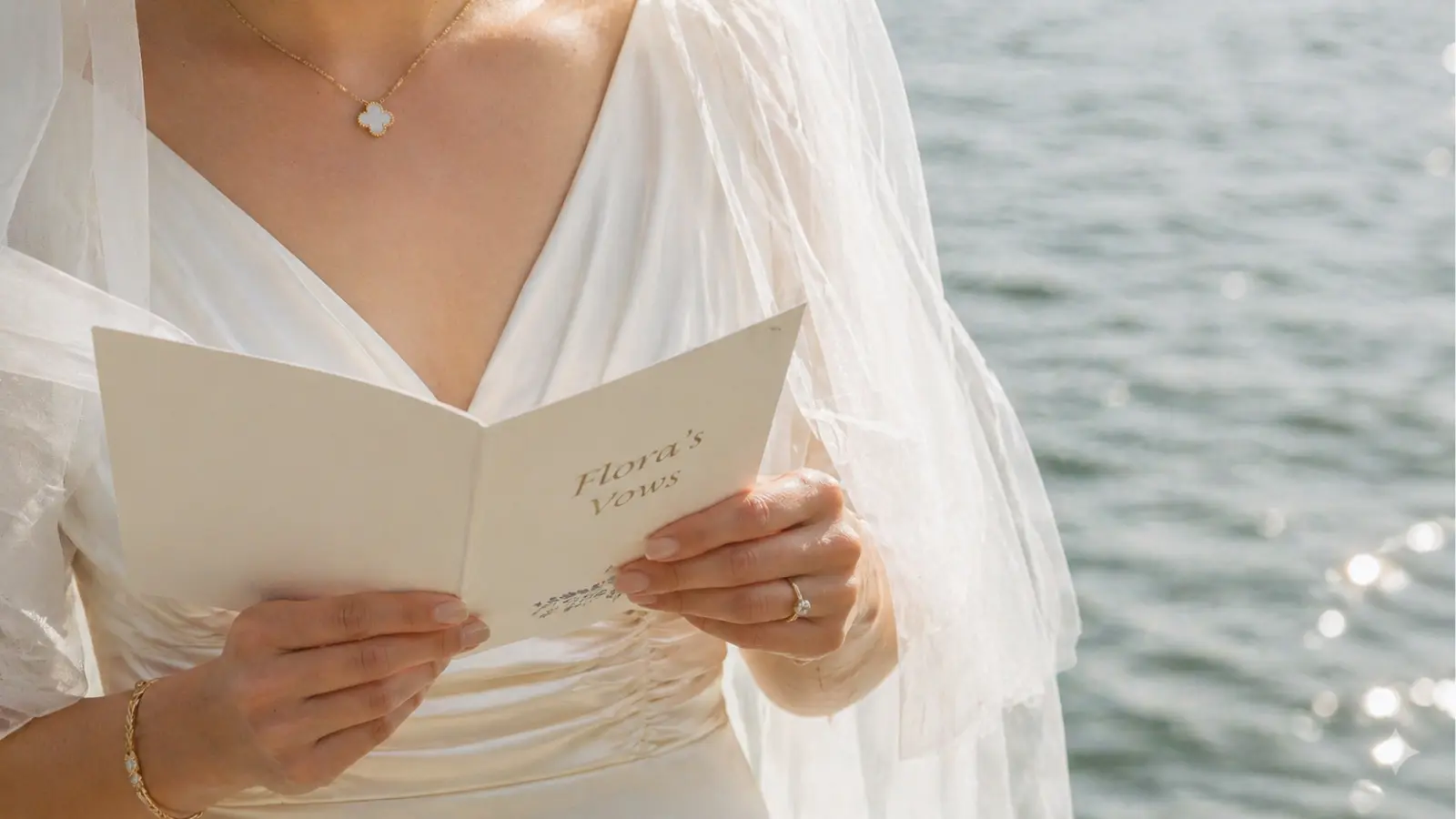 bride reading wedding vows by water