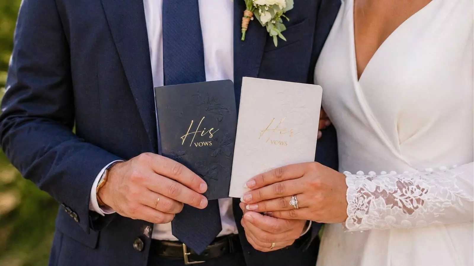 Couple holding his and hers wedding vow books