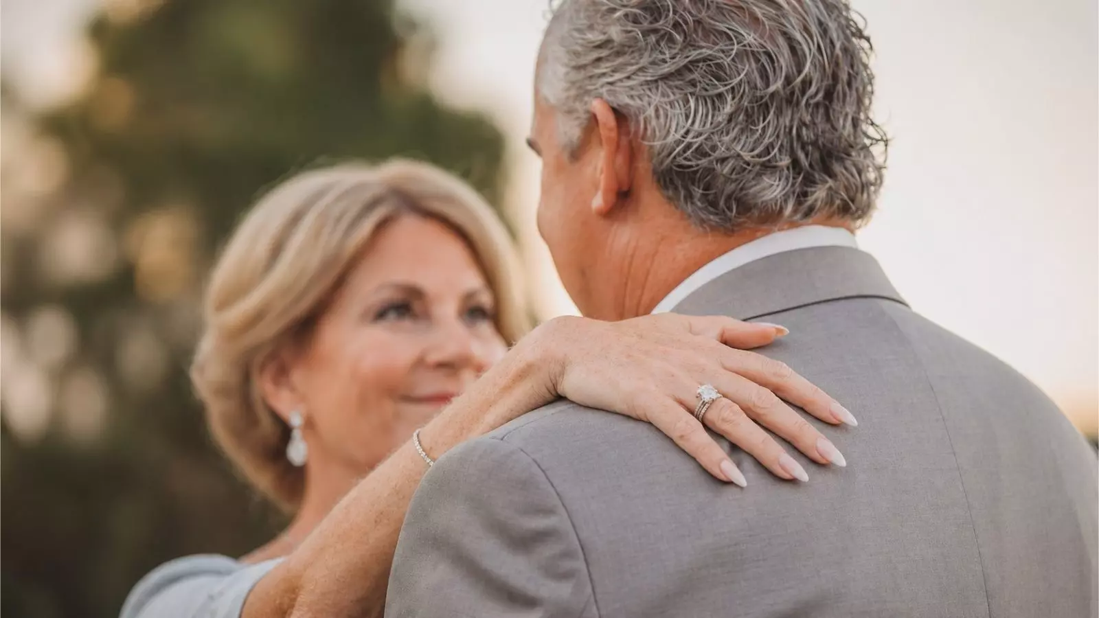 mature couple embracing during vow renewal ceremony