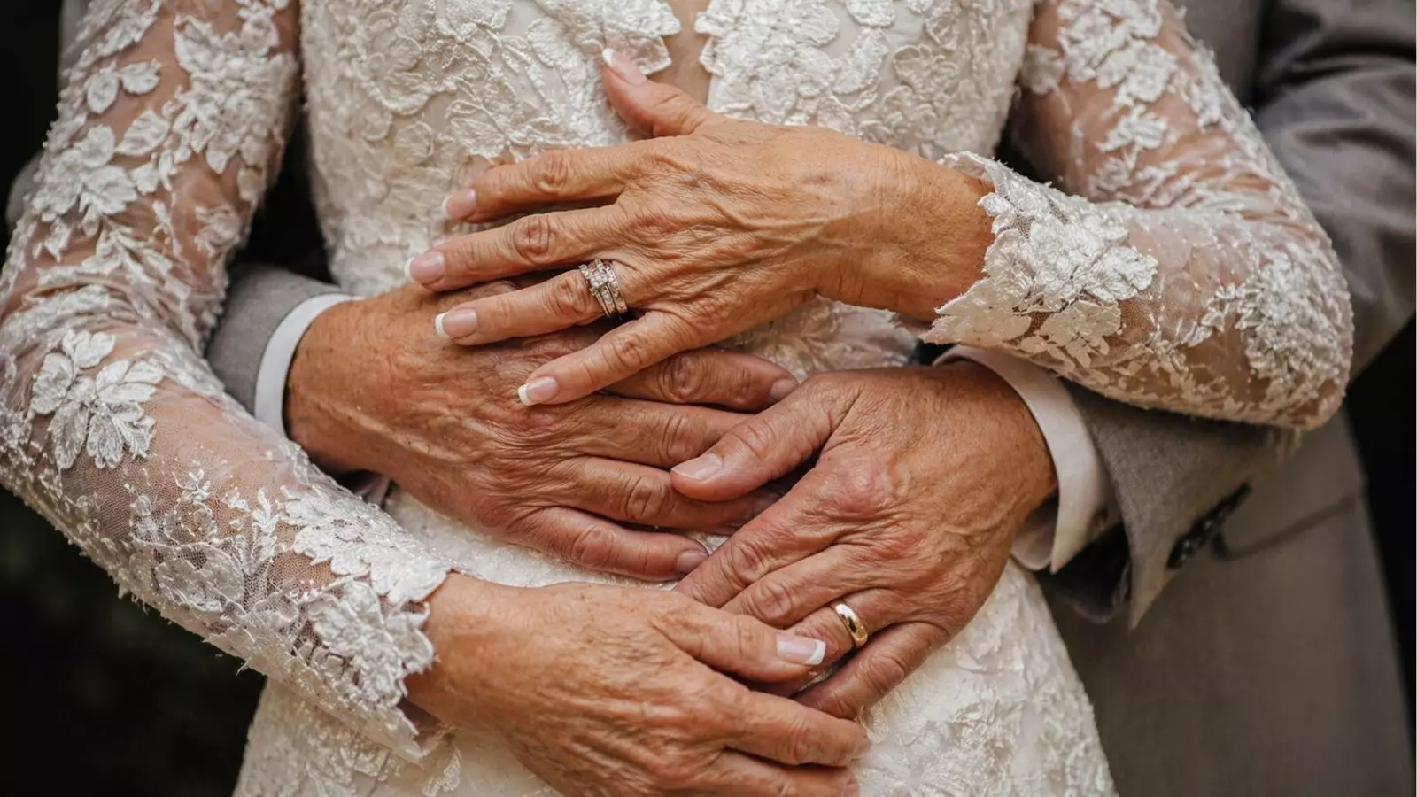 close up of hands and wedding rings vow renewal