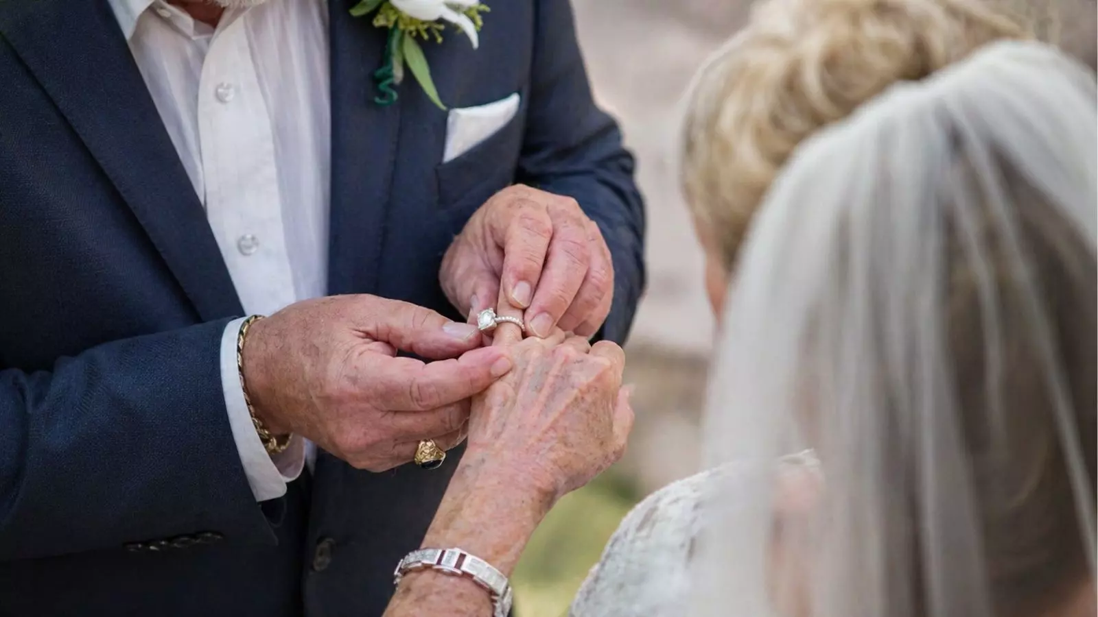 placing ring during vow renewal close up