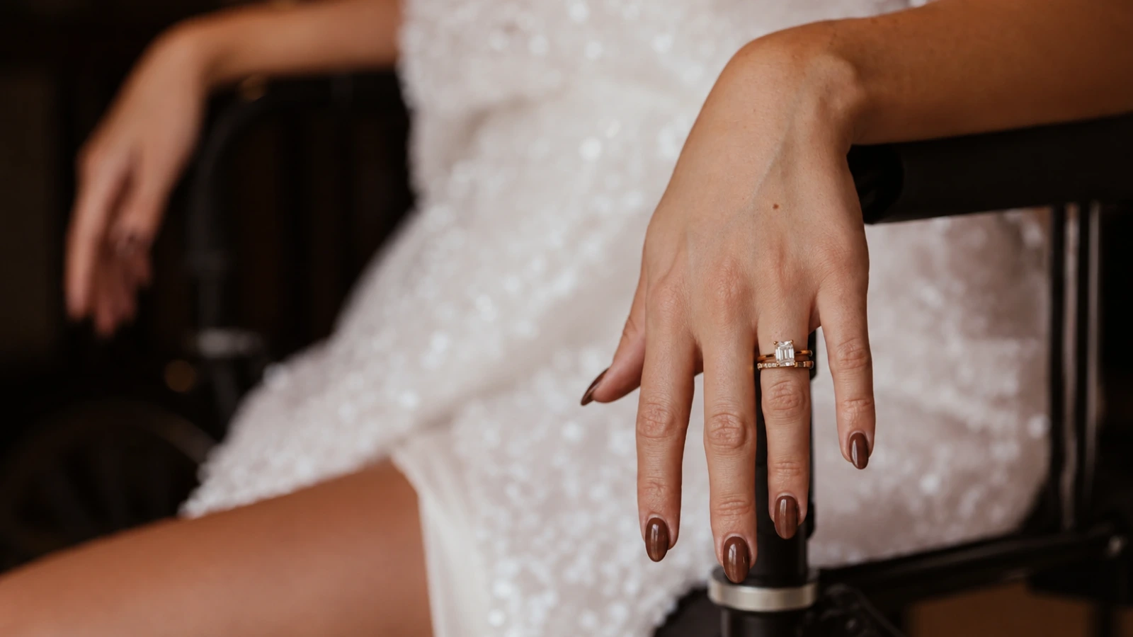 Elegant brown fall wedding nails with sparkling bridal dress