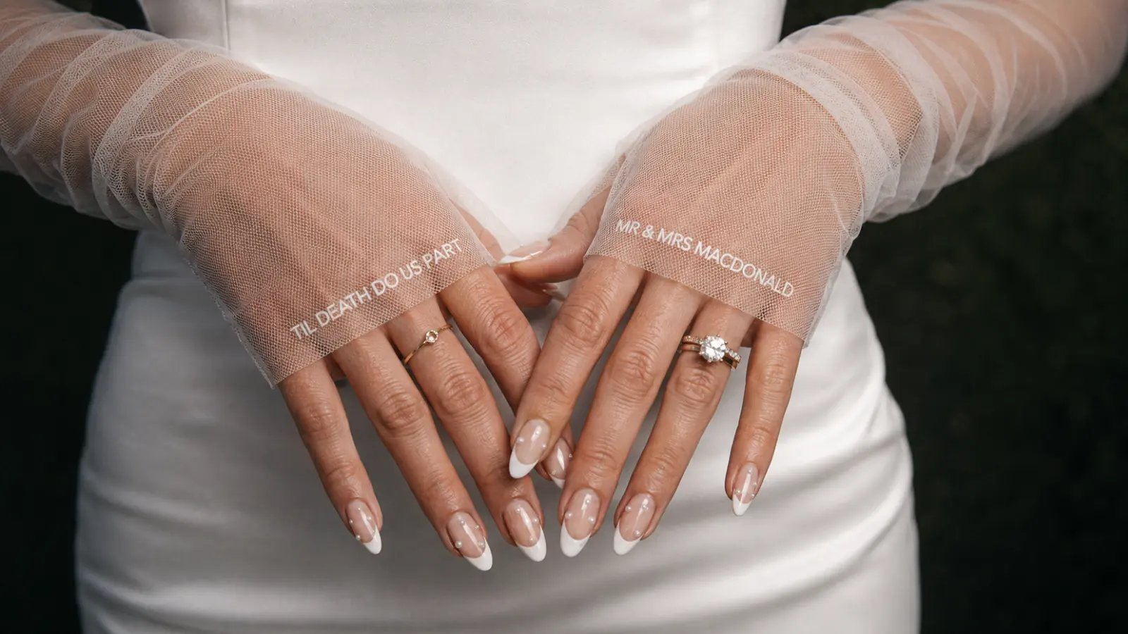Pearl French tip bridal nails with personalized sheer wedding gloves