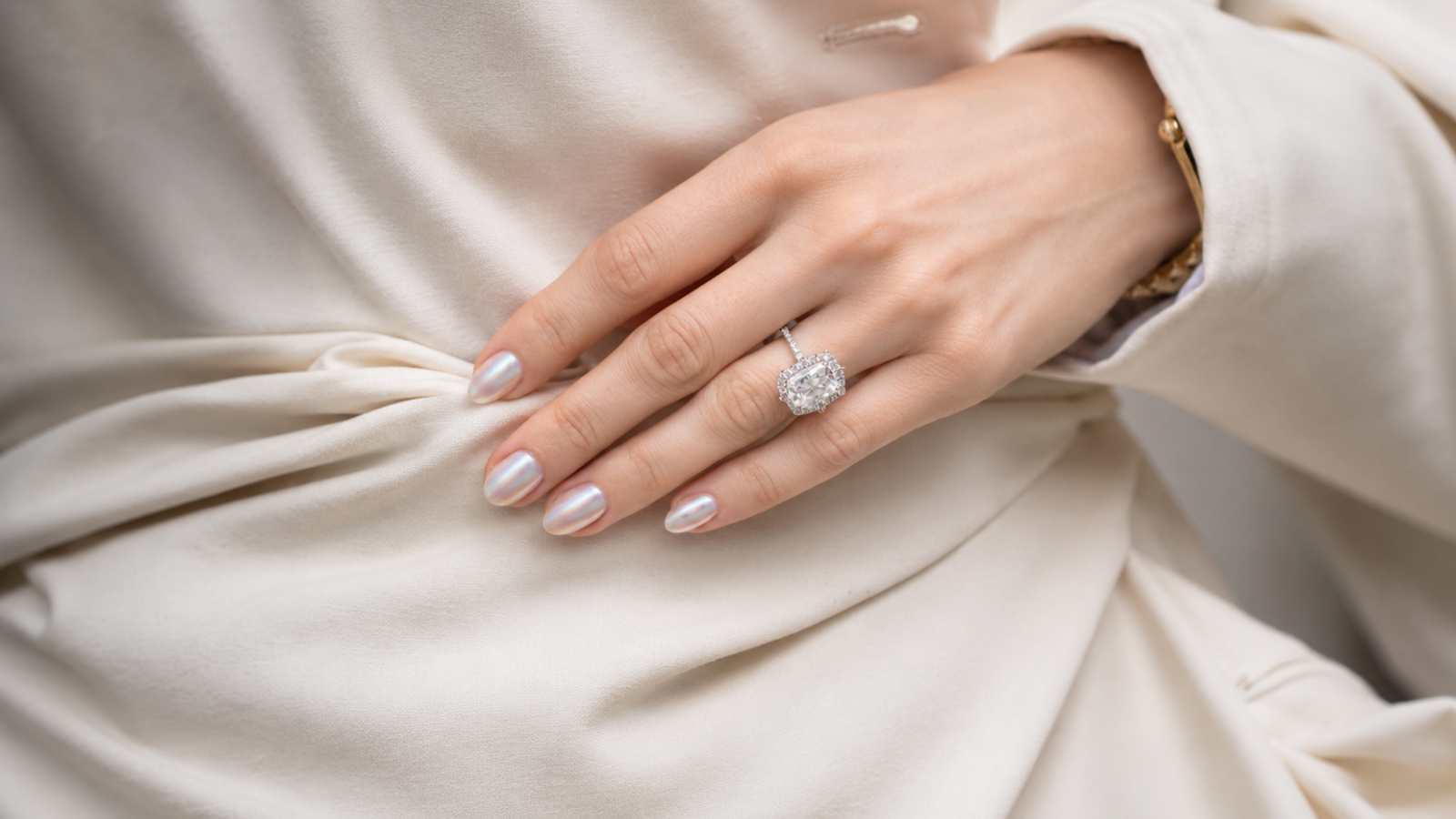 Short chrome bridal nails with satin fabric and engagement ring