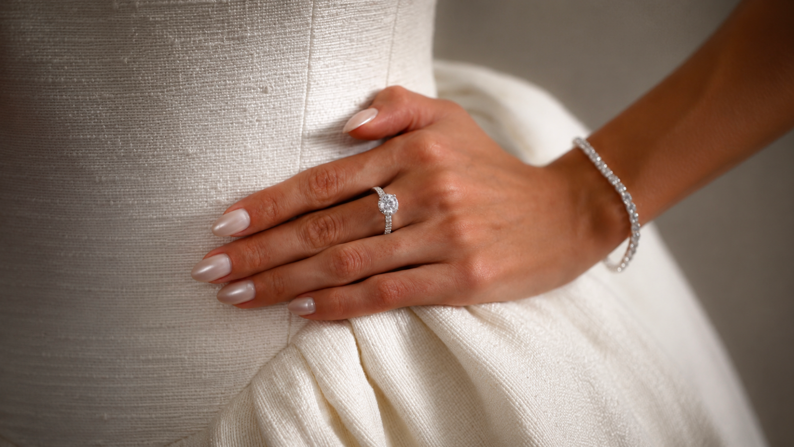simple wedding nails with soft pearl nude manicure and diamond ring