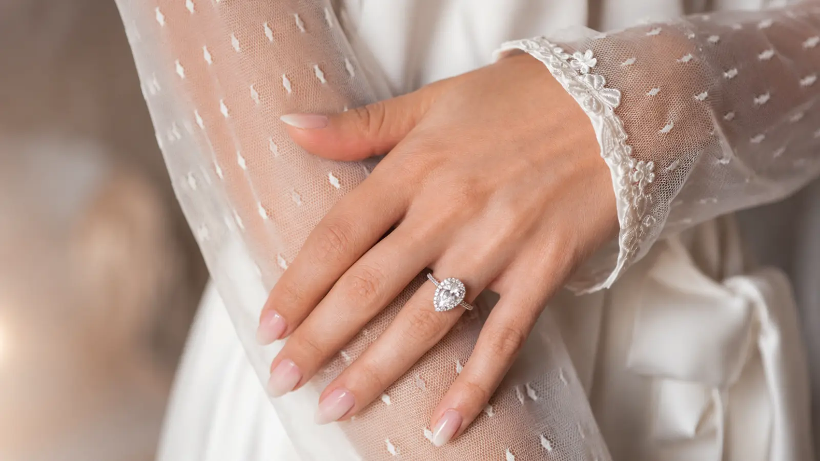 Soft pink ombré wedding nails with embroidered bridal sleeves