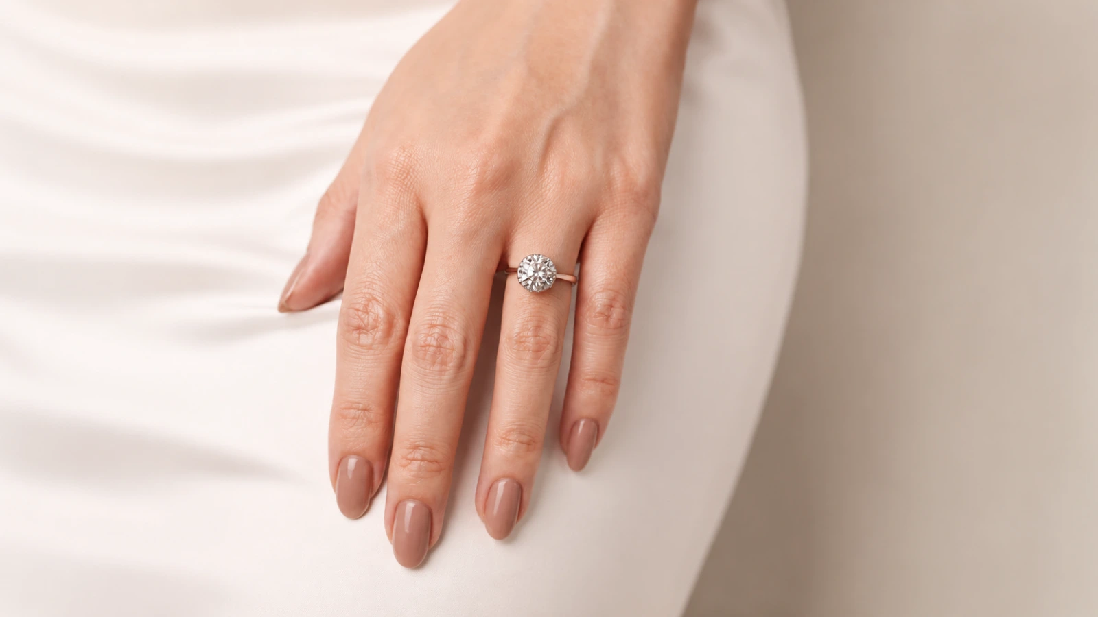 Minimal taupe fall wedding nails with engagement ring