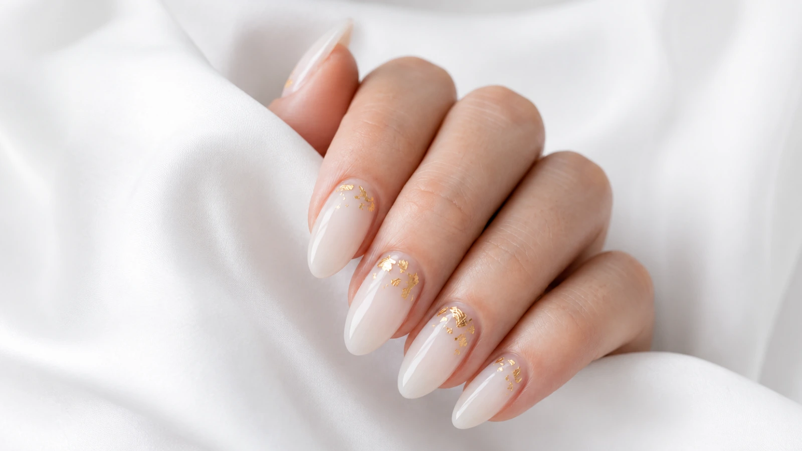 White and gold fall wedding nails with bridal fabric
