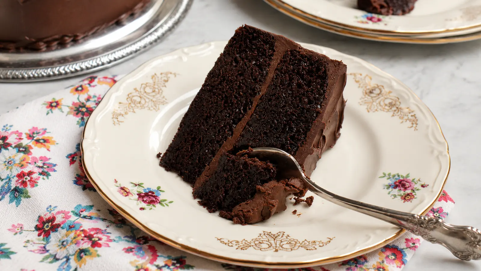 Chocolate wedding cake slice with rich frosting