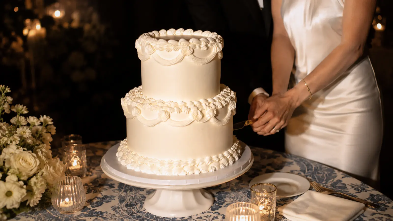 Classic two tier wedding cake with white frosting