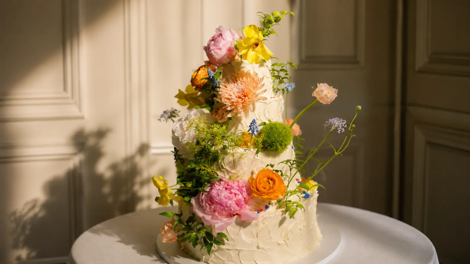 Colorful floral wedding cake with fresh flowers