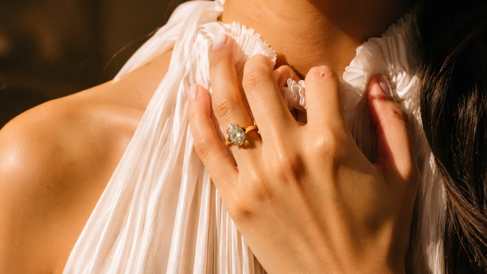 Diamond ring on a bride’s hand showing design differences between decorative wedding rings and classic wedding bands.