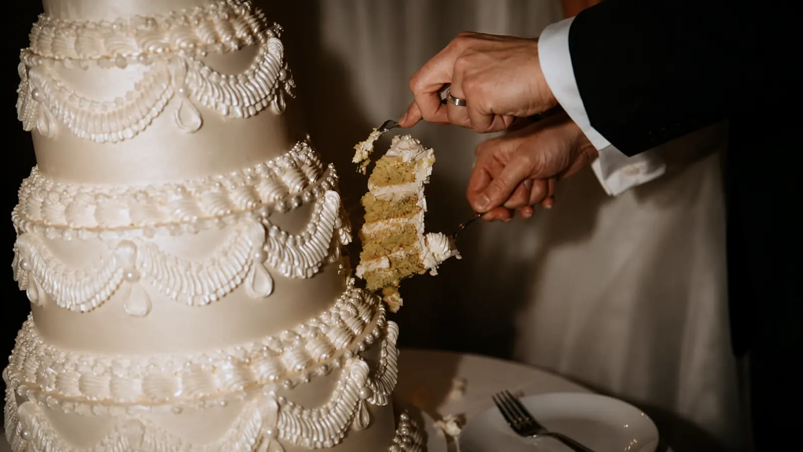 Elegant vintage inspired wedding cake with classic white details