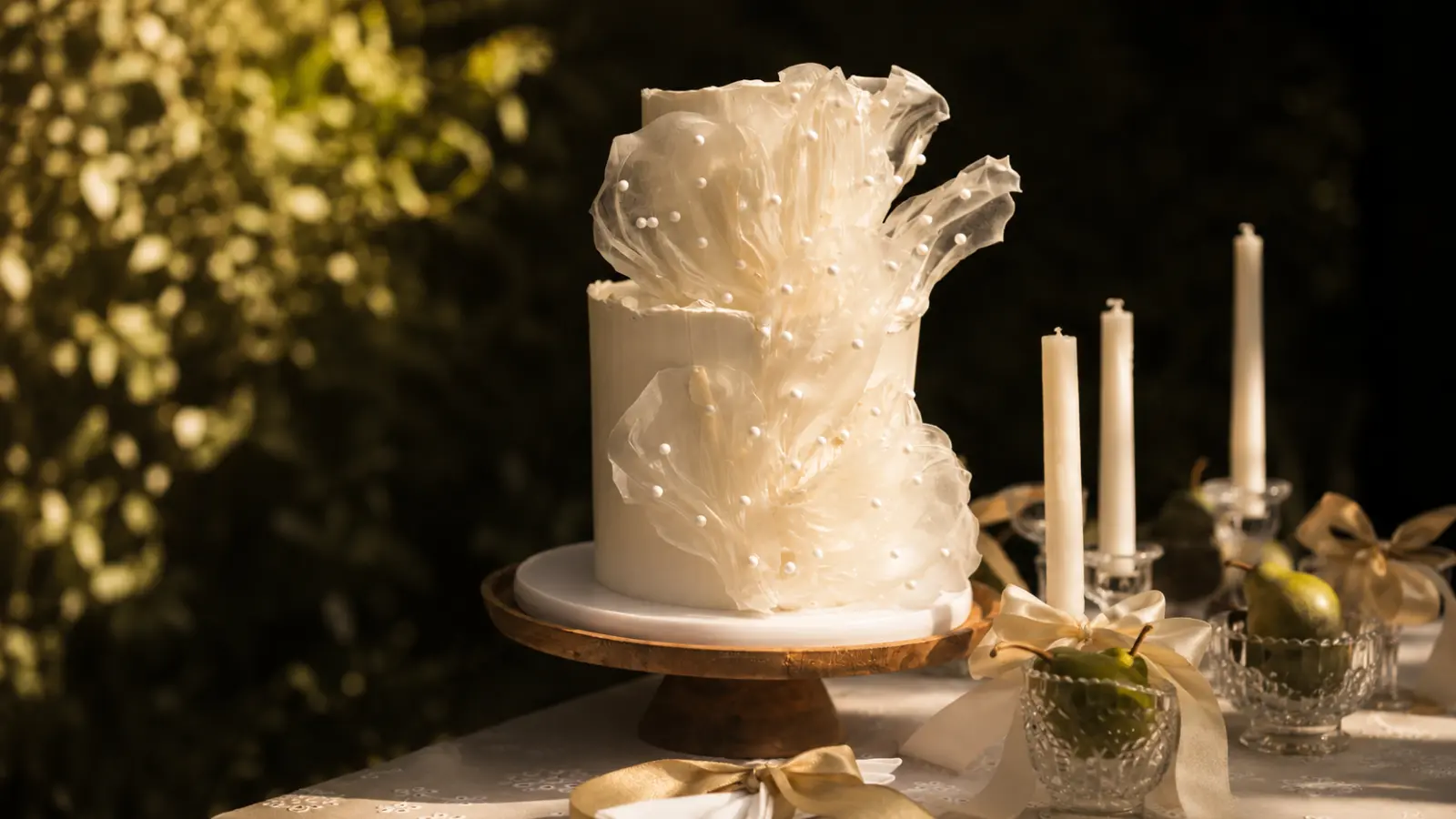 Modern minimal white wedding cake with artistic decoration