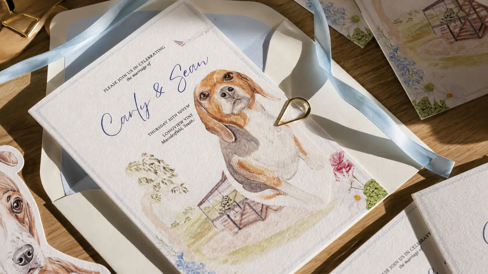 Personalized wedding invitation featuring a watercolor illustration of the couple's dog alongside elegant floral wedding stationery