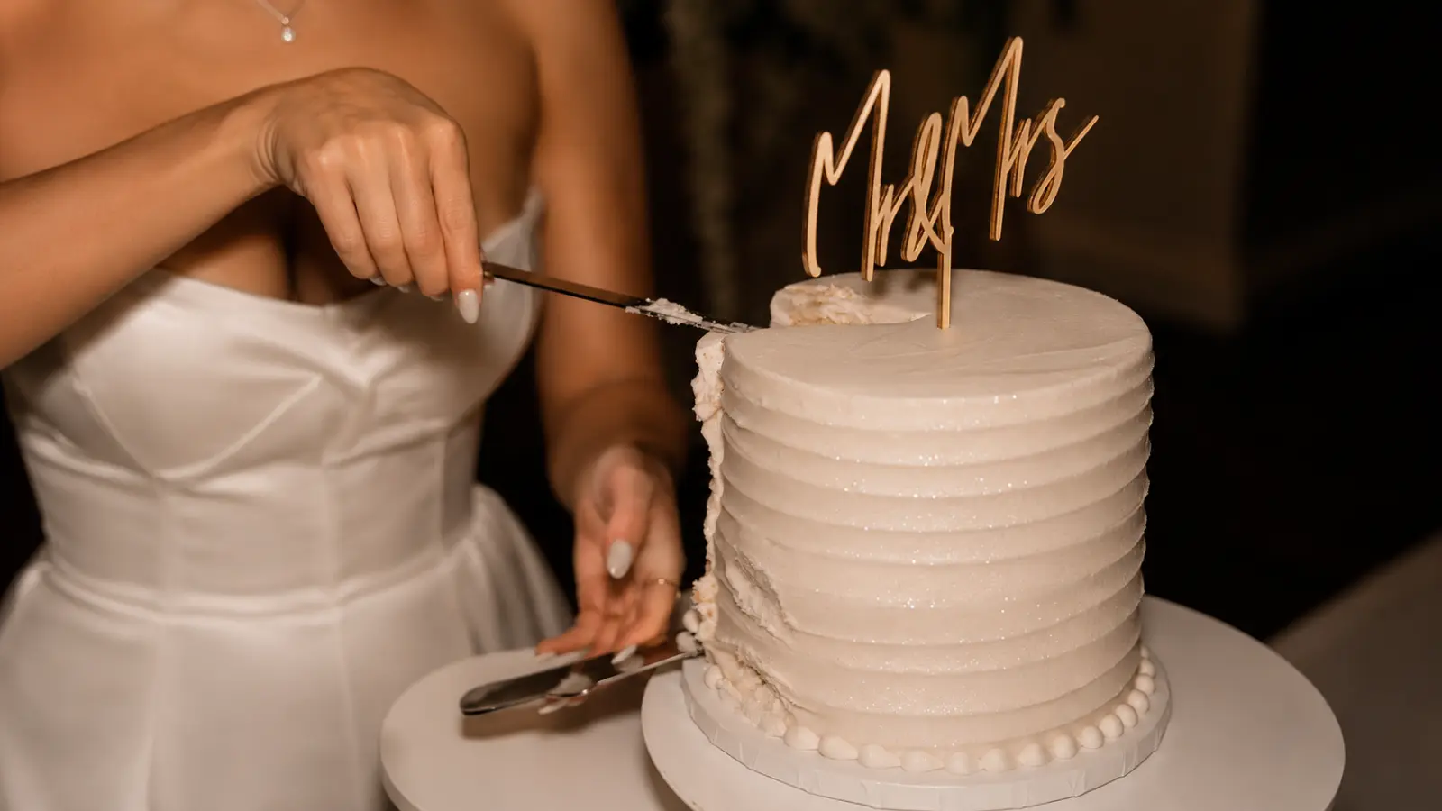 Simple one tier wedding cake with classic white buttercream finish