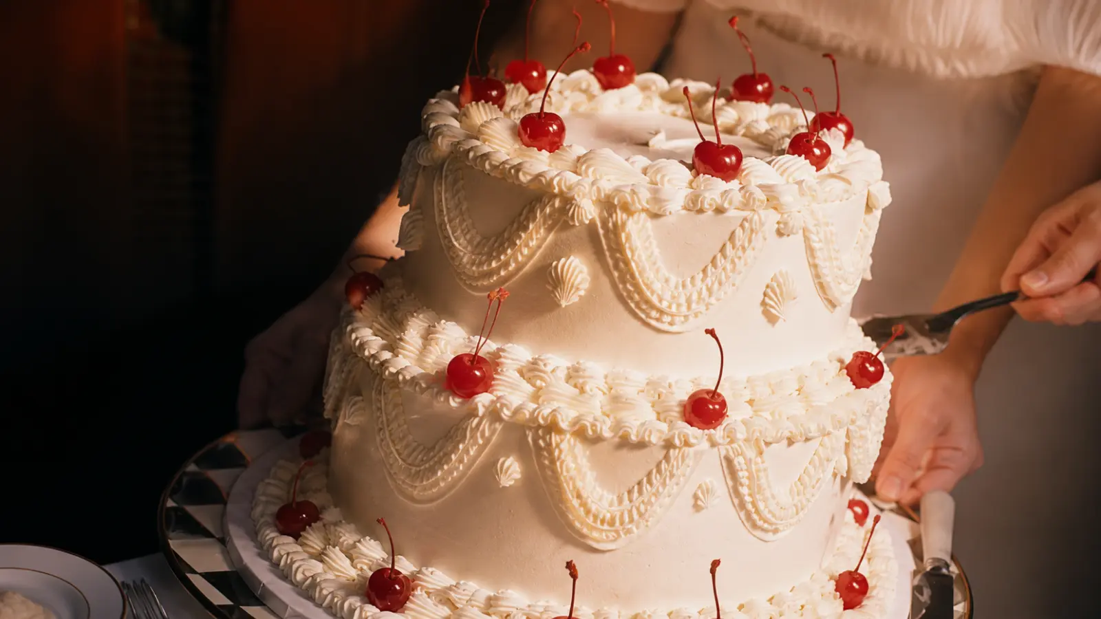 Vintage Lambeth wedding cake with cherries and ornate piping
