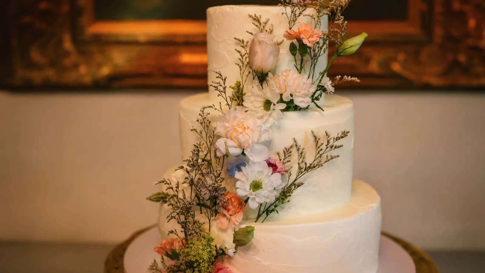 Seasonal floral wedding cake with fresh flowers and elegant decorations