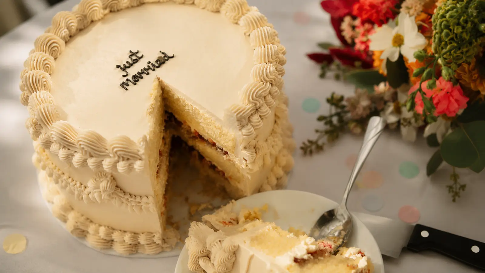 Wedding cake slice showing layers, filling, frosting texture, and flavor inspiration
