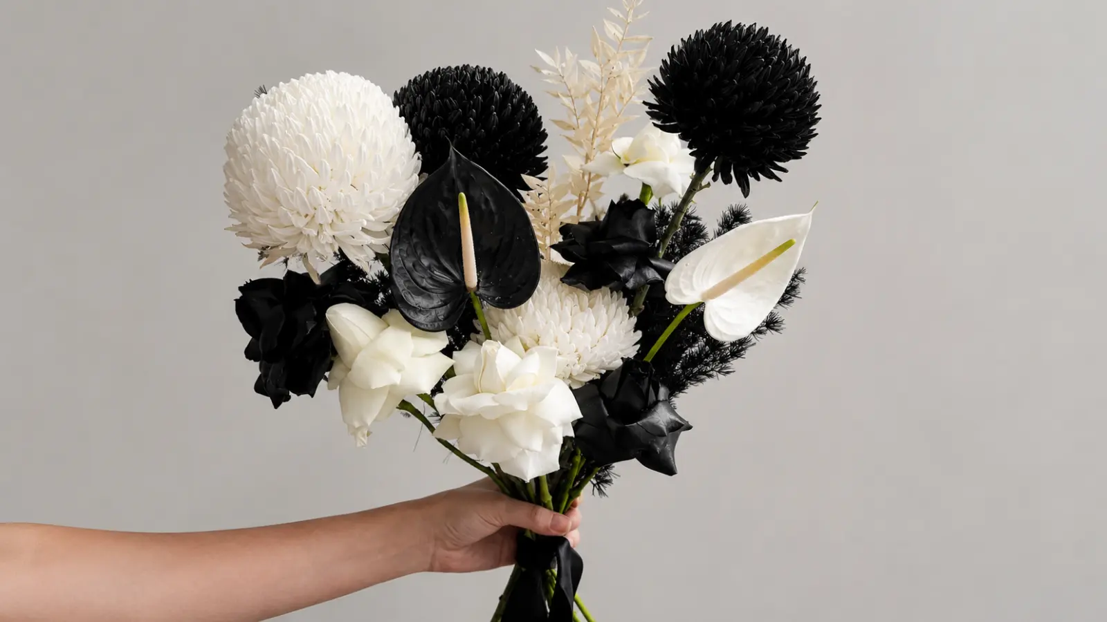 Black and white wedding bouquet with anthuriums, roses and chrysanthemums