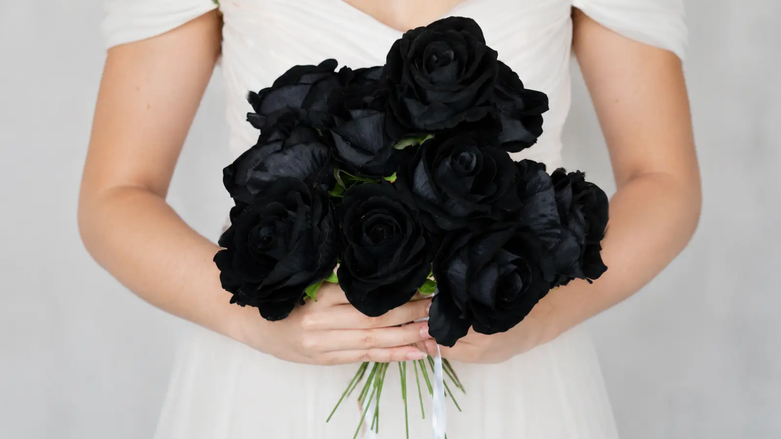 Bride holding a black rose wedding bouquet Black Wedding Bouquets