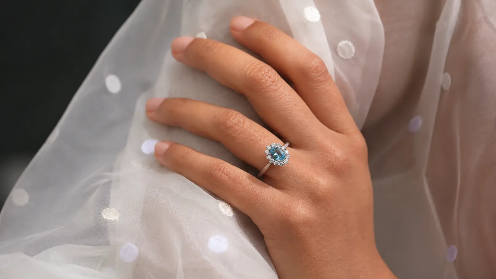 A blue gemstone engagement ring serving as an elegant alternative to a traditional diamond ring