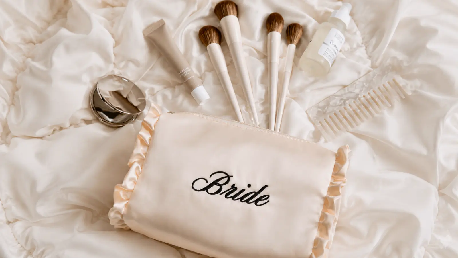Personalized Bride pouch with makeup brushes skincare products compact mirror and comb for wedding day beauty touch-ups