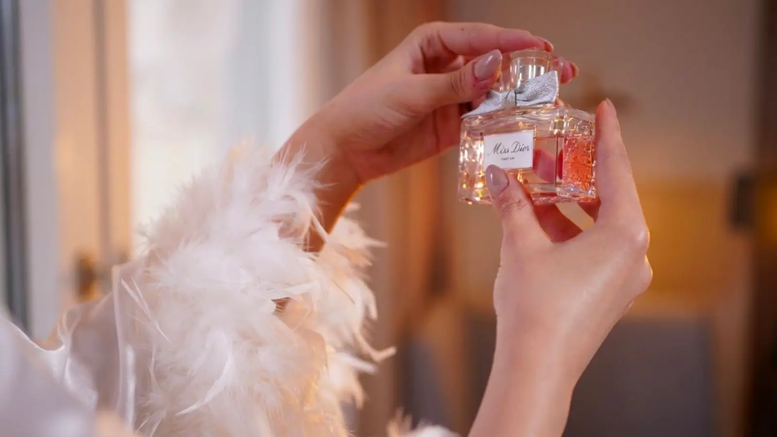 A bride carefully holding and admiring an elegant perfume bottle while choosing her signature wedding fragrance, considering the scent, mood, season, and personal style for her special day