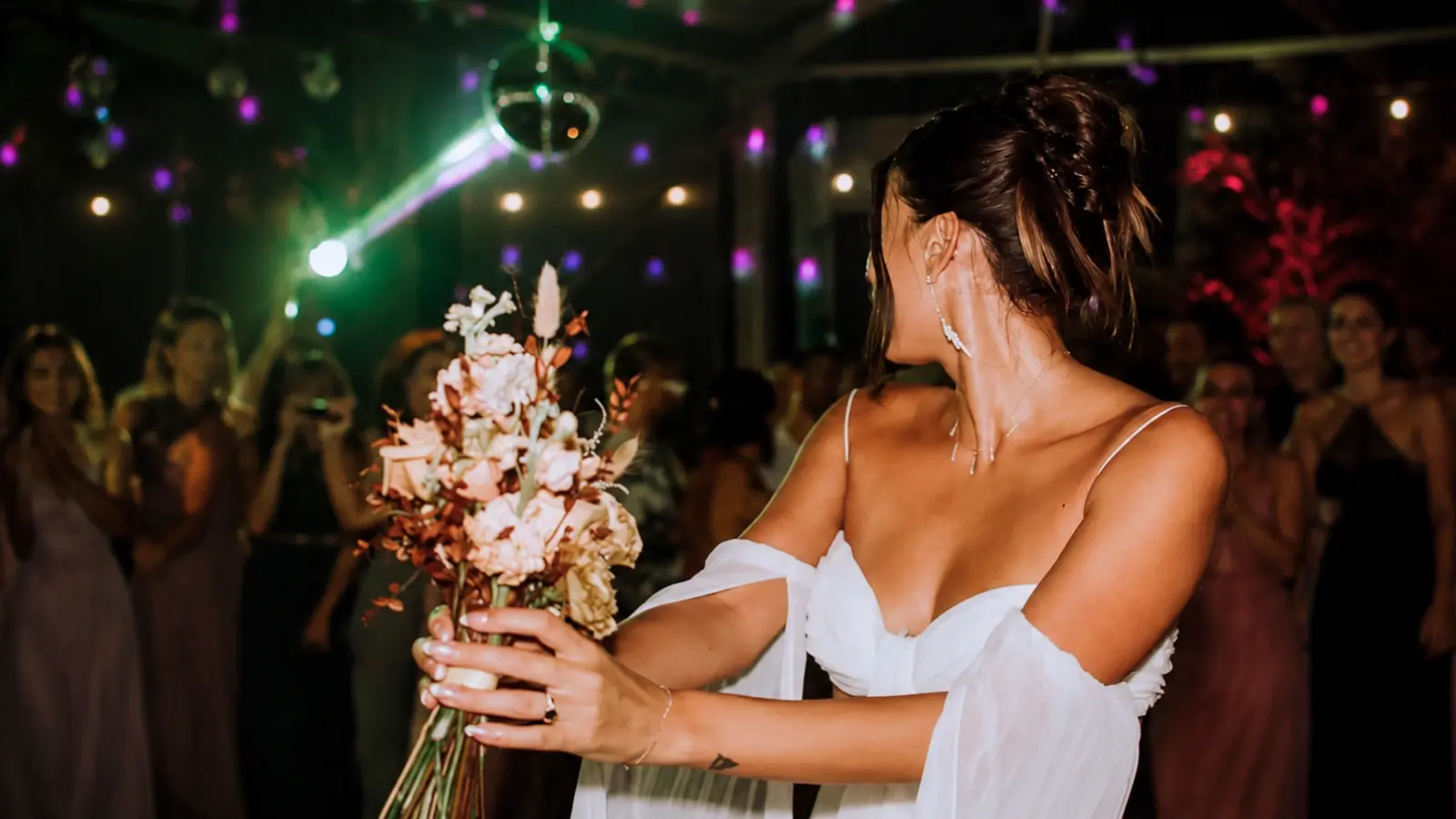 Bride preparing to throw her wedding bouquet at the reception Wedding Bouquet Toss