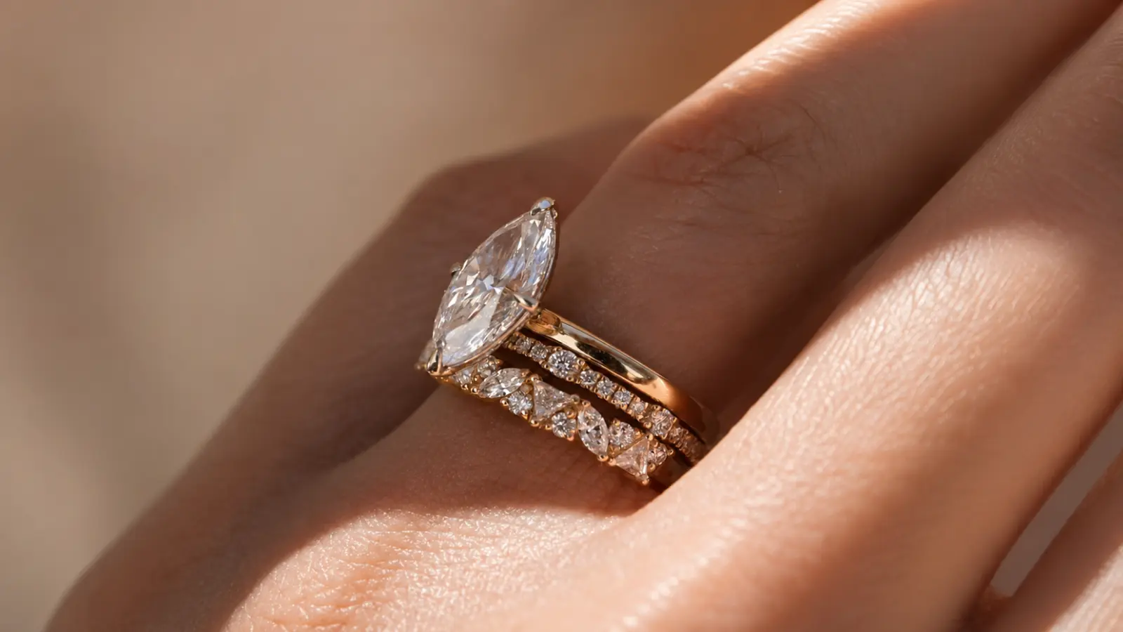 A close-up of a diamond chevron wedding band designed to complement marquise engagement rings