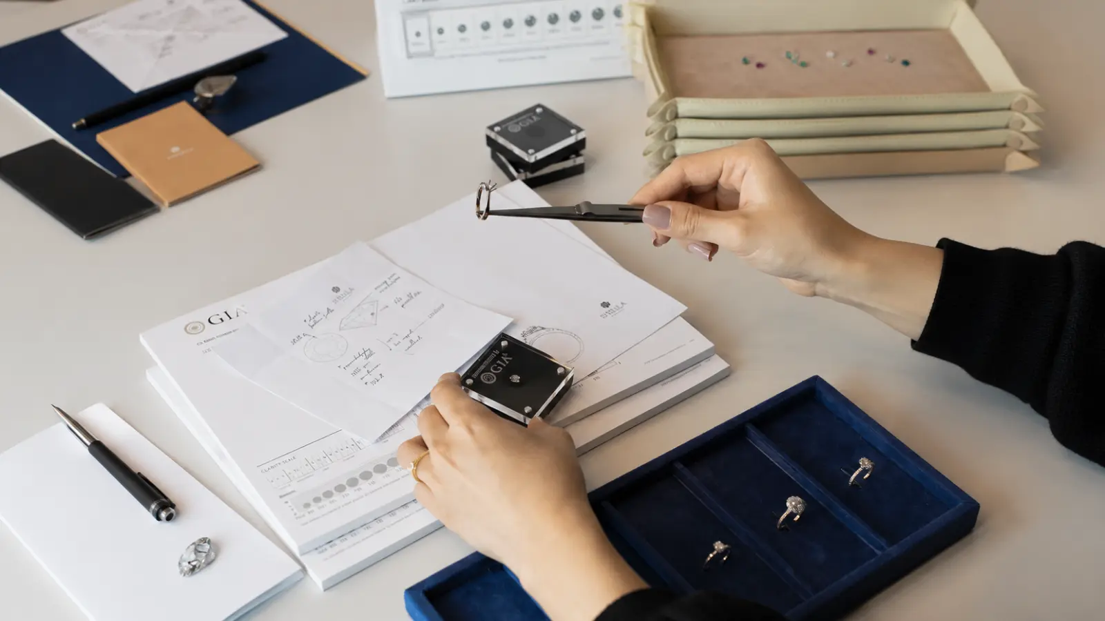 Jewelry appraisal paperwork and grading reports prepared to insure a valuable engagement ring
