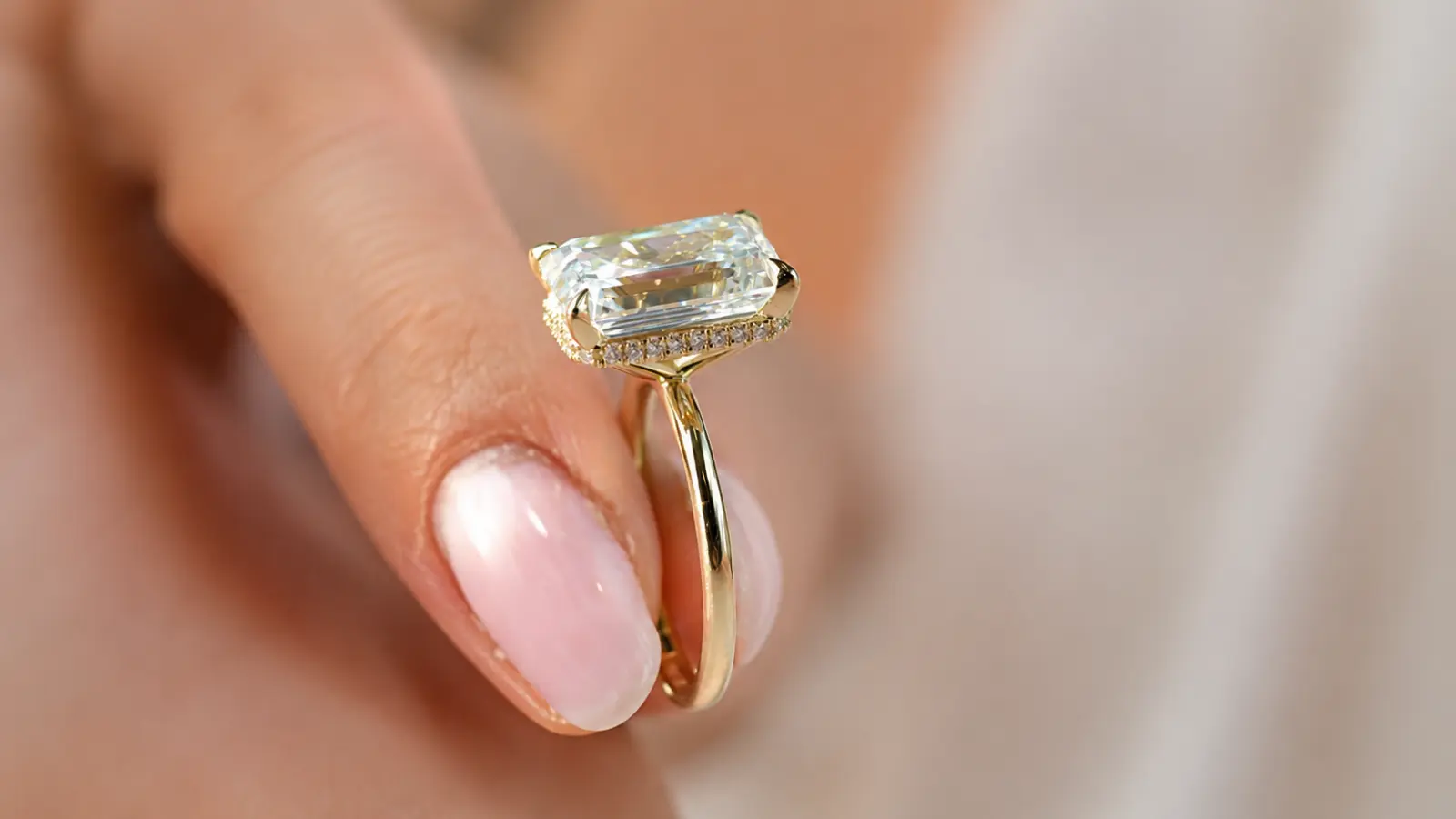 A side view of an emerald cut engagement ring showing its basket setting and profile Wedding Bands for Emerald Cut Engagement Rings