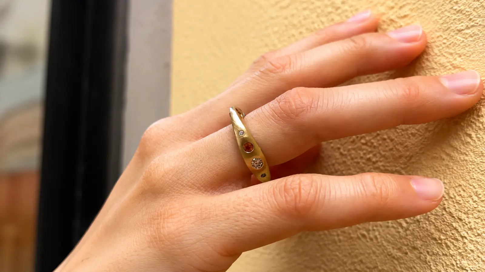 A unique gemstone wedding ring worn as a stylish alternative to a traditional wedding band Alternative Wedding Rings