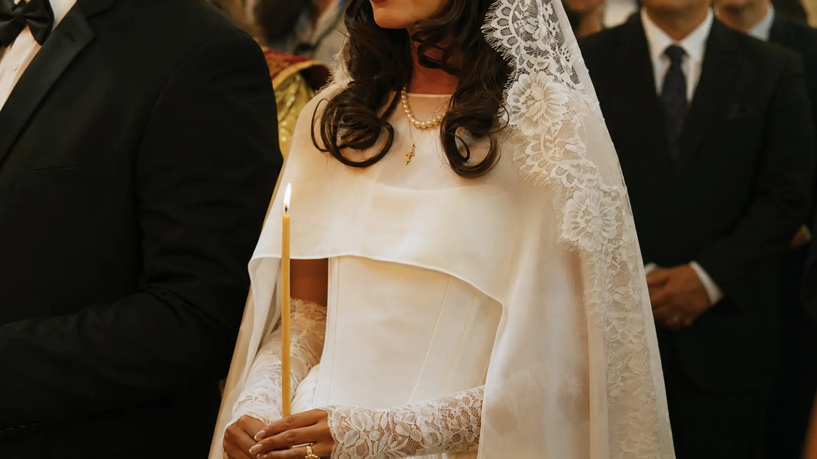 Bride wearing a lace wedding veil during a religious wedding ceremony, symbolizing tradition, modesty, and commitment