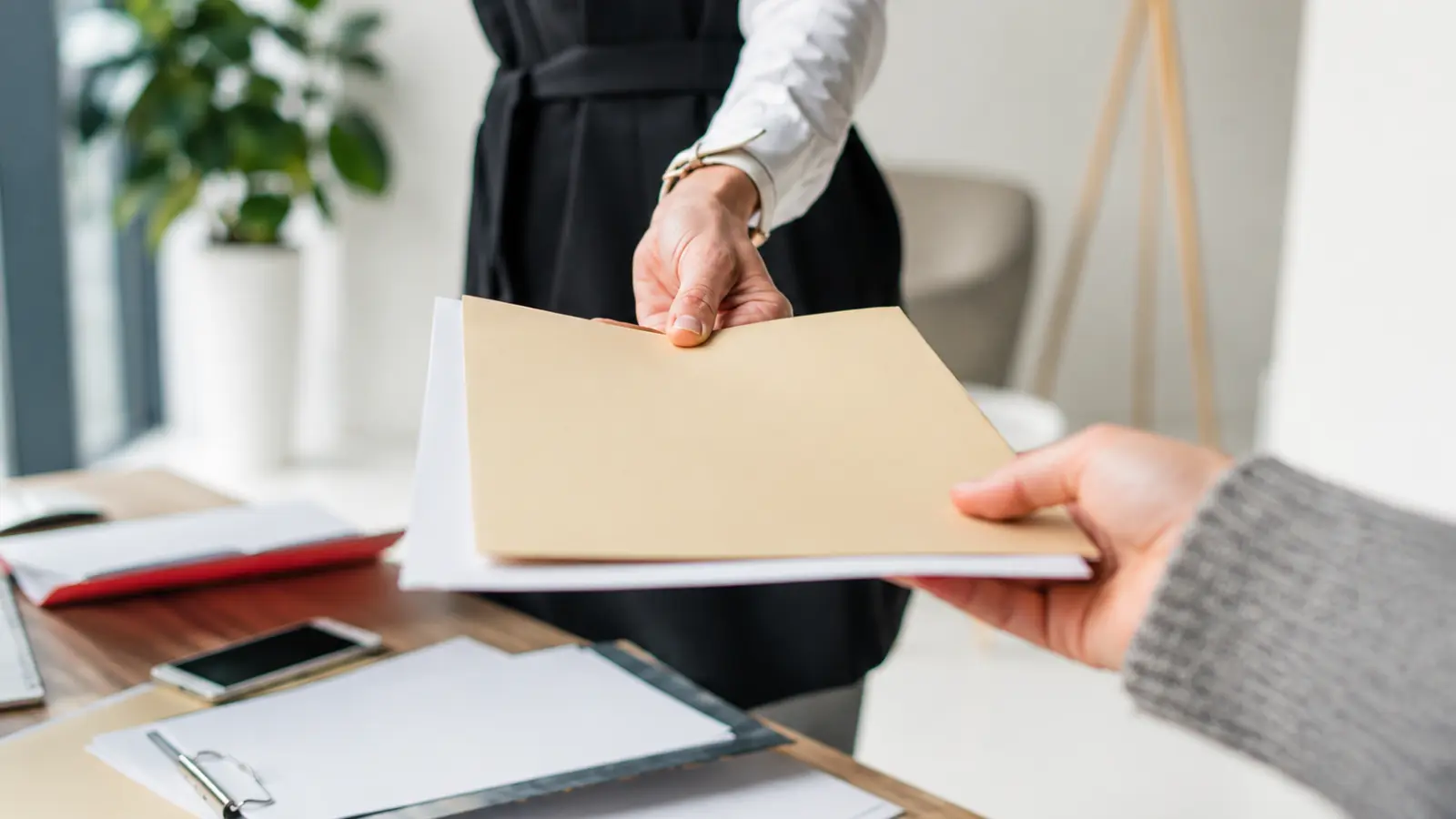 Newlywed receiving official documents as part of the legal and administrative tasks to complete after getting married What to Do After Getting Married: Legal and Administrative Checklist