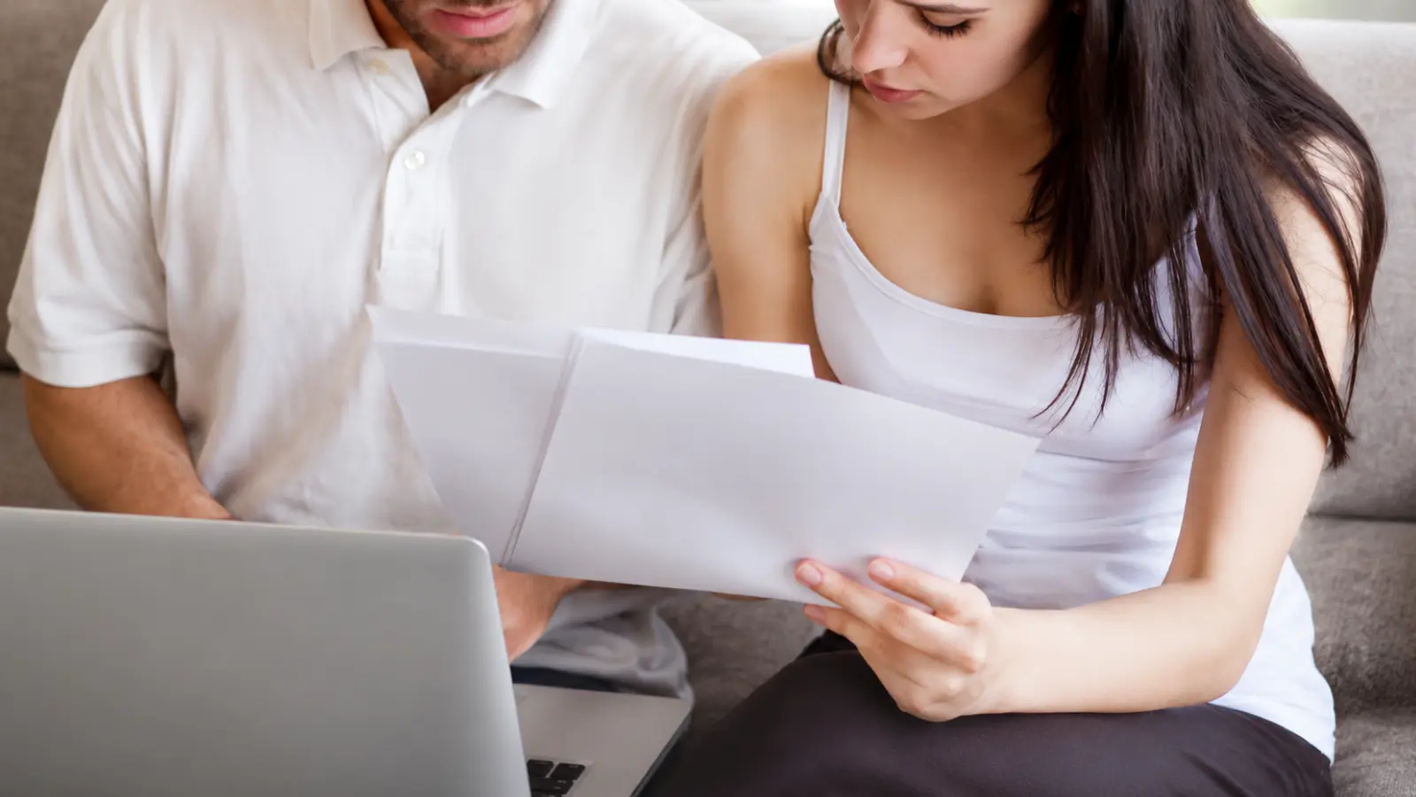 Couple reviewing documents together at home as they organize records that may help establish evidence of a common law marriage Common Law Marriage: Meaning, Requirements, Evidence and Legal Recognition
