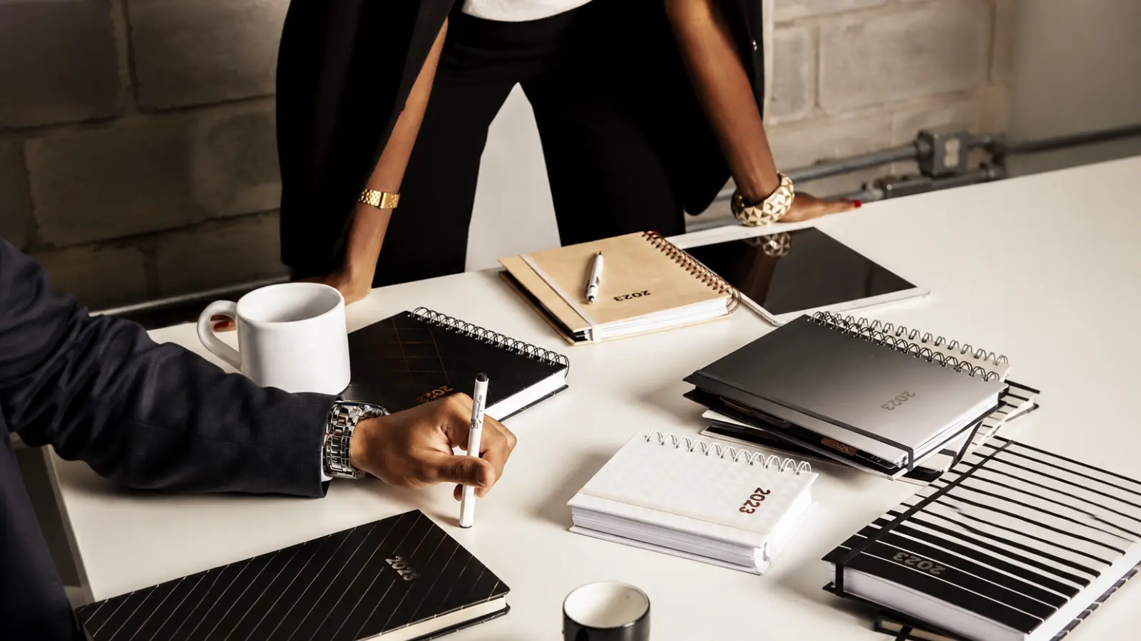 Team assigning wedding planning tasks and responsibilities during an organized planning meeting