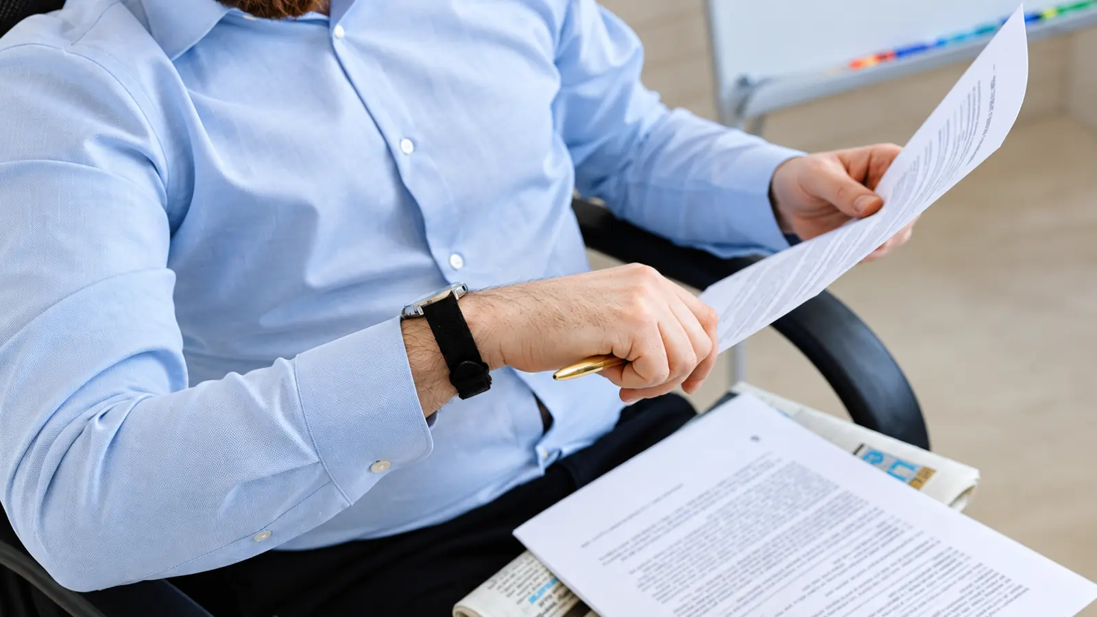 Man reviewing official documents while preparing to become a wedding officiant, representing legal steps, registration requirements and officiant qualifications How to Become a Wedding Officiant: Legal Steps and Requirements