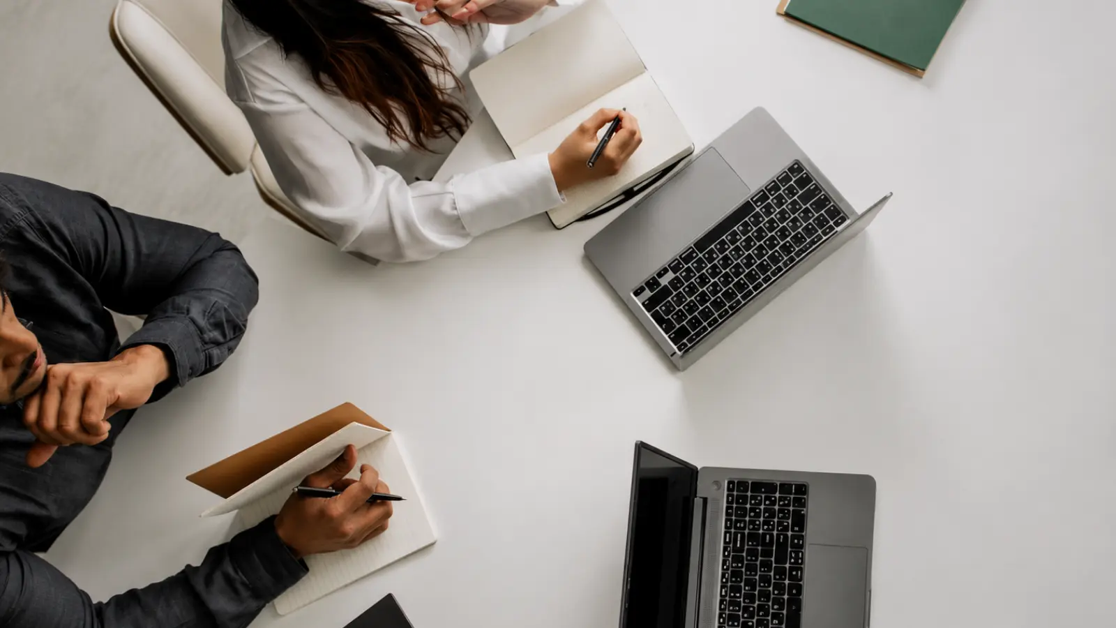 How to Budget for a Wedding with a couple reviewing notes and laptops together, representing the process of setting priorities, estimating expenses and building a realistic wedding budget How to Budget for a Wedding: Build a Realistic Wedding Budget
