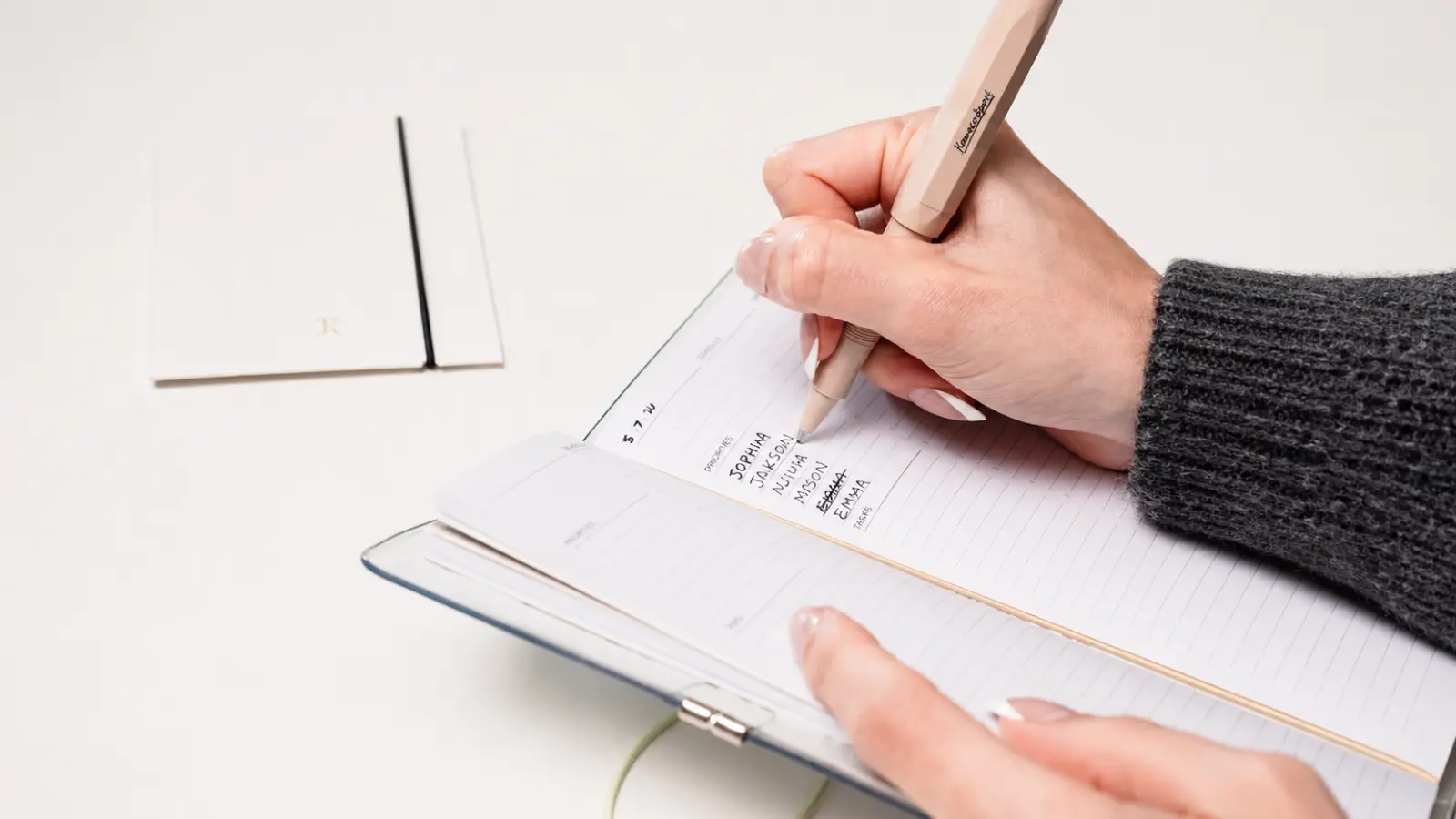 How to Cut a Wedding Guest List shown through a handwritten list being reviewed and edited to reduce the number of wedding guests How to Cut a Wedding Guest List Without Guesswork