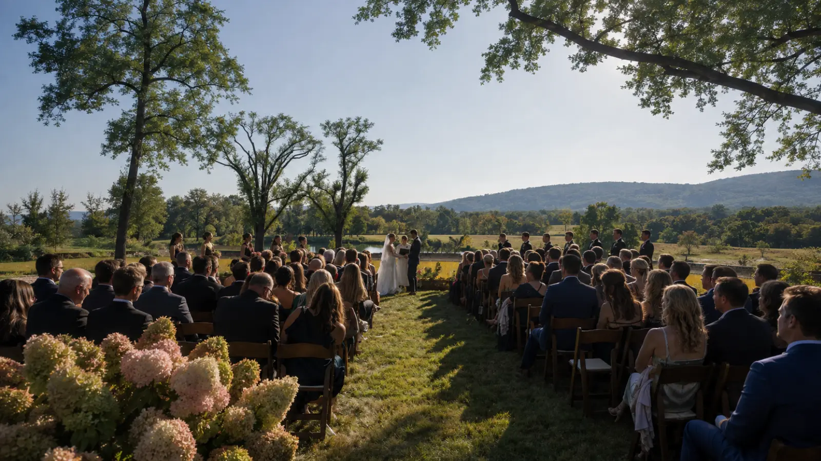 Intimate outdoor wedding ceremony with the couple exchanging vows in front of close guests in a scenic countryside setting