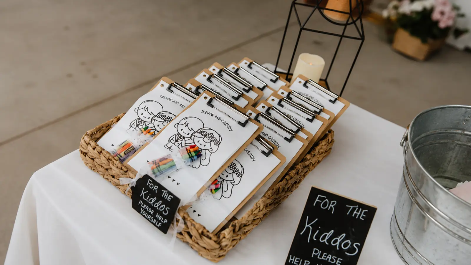 Coloring sheets and crayons prepared on clipboards for children, offering an easy wedding activity that keeps younger guests creatively occupied during quieter reception moments Wedding Activities for Kids