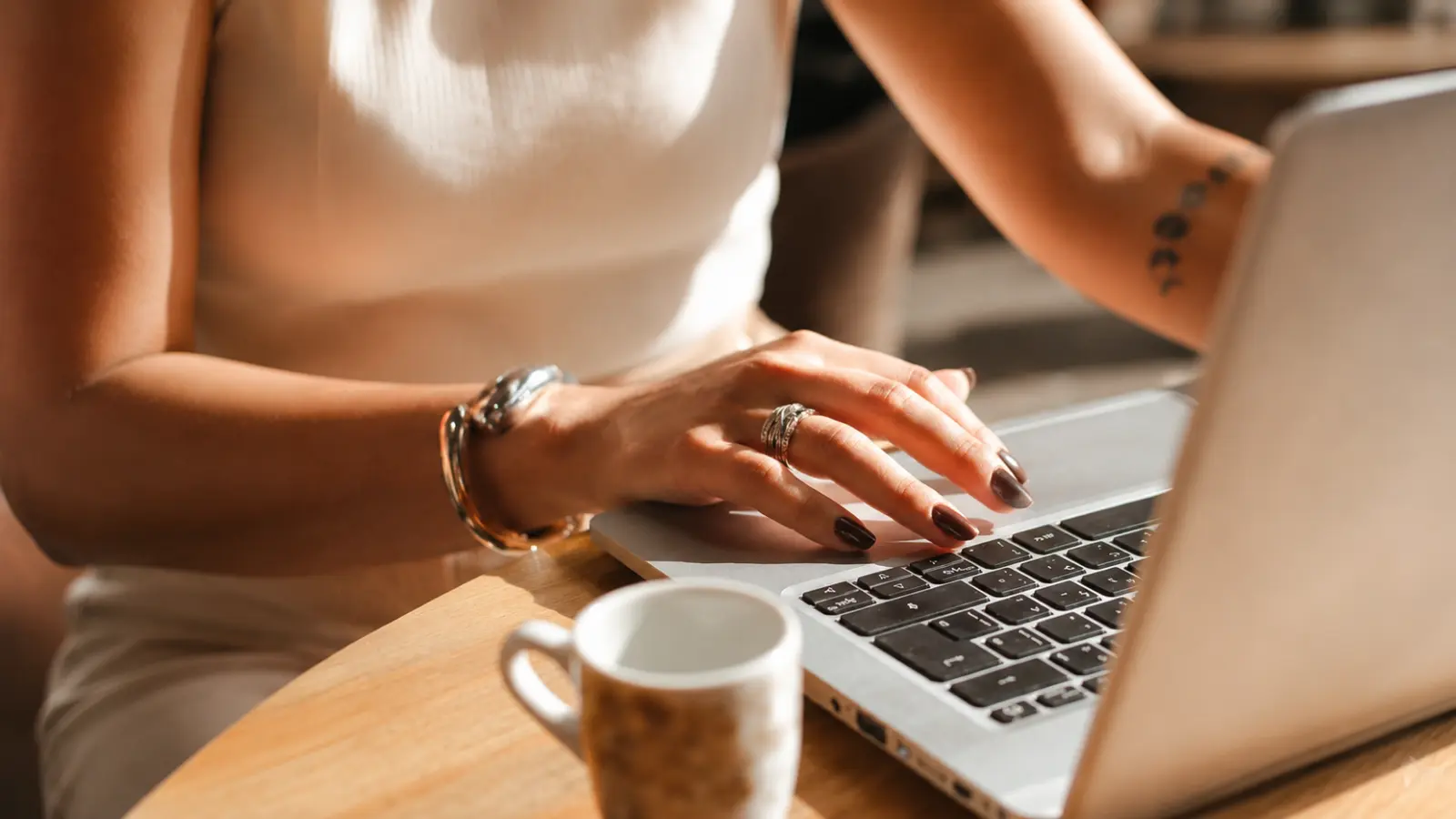 Bride using a laptop to research wedding decisions and avoid common wedding planning mistakes Wedding Planning Mistakes: Why They Happen and How to Avoid Them