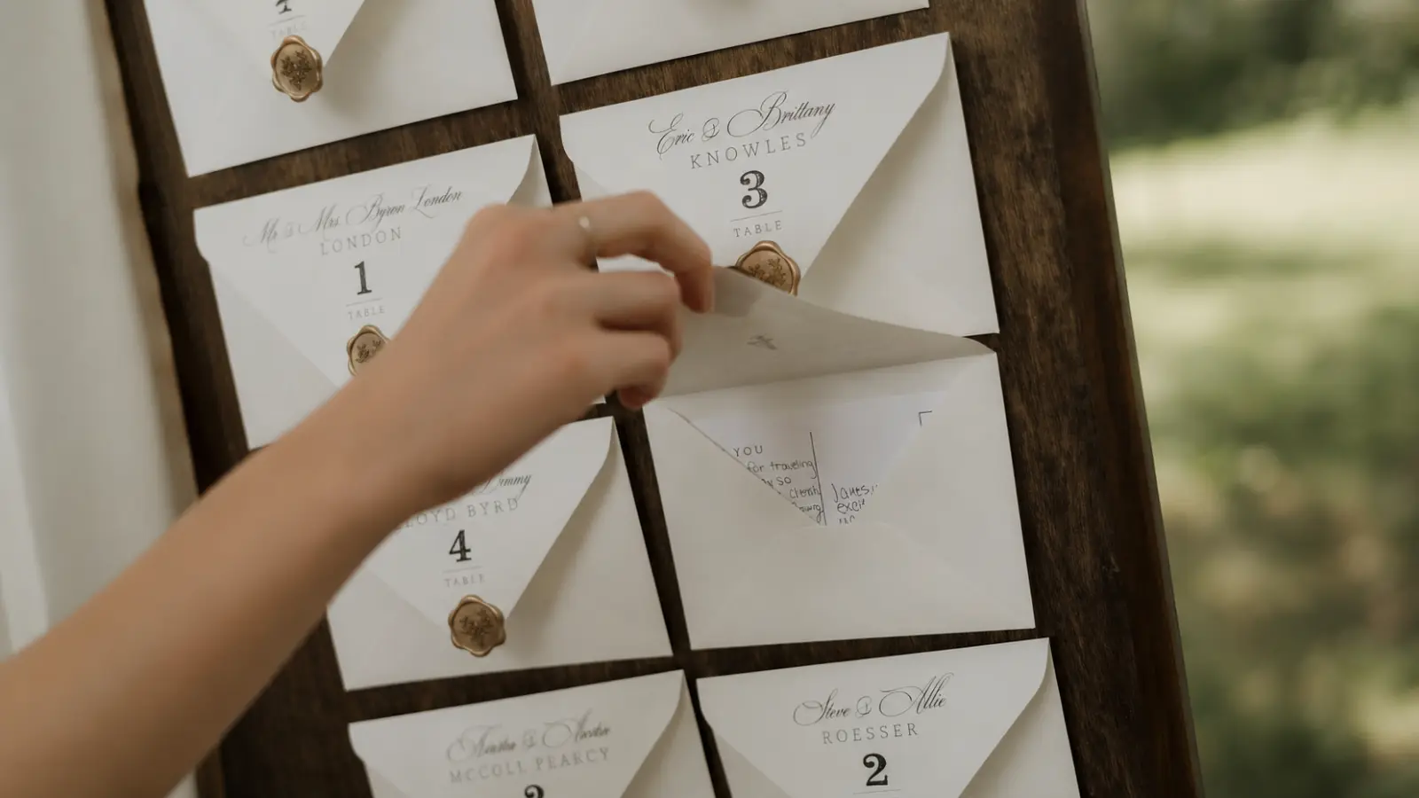 Wedding Seating Chart displayed as individual guest envelopes with names and table numbers for organized reception seating Wedding Seating Chart: How to Seat Guests Without the Stress