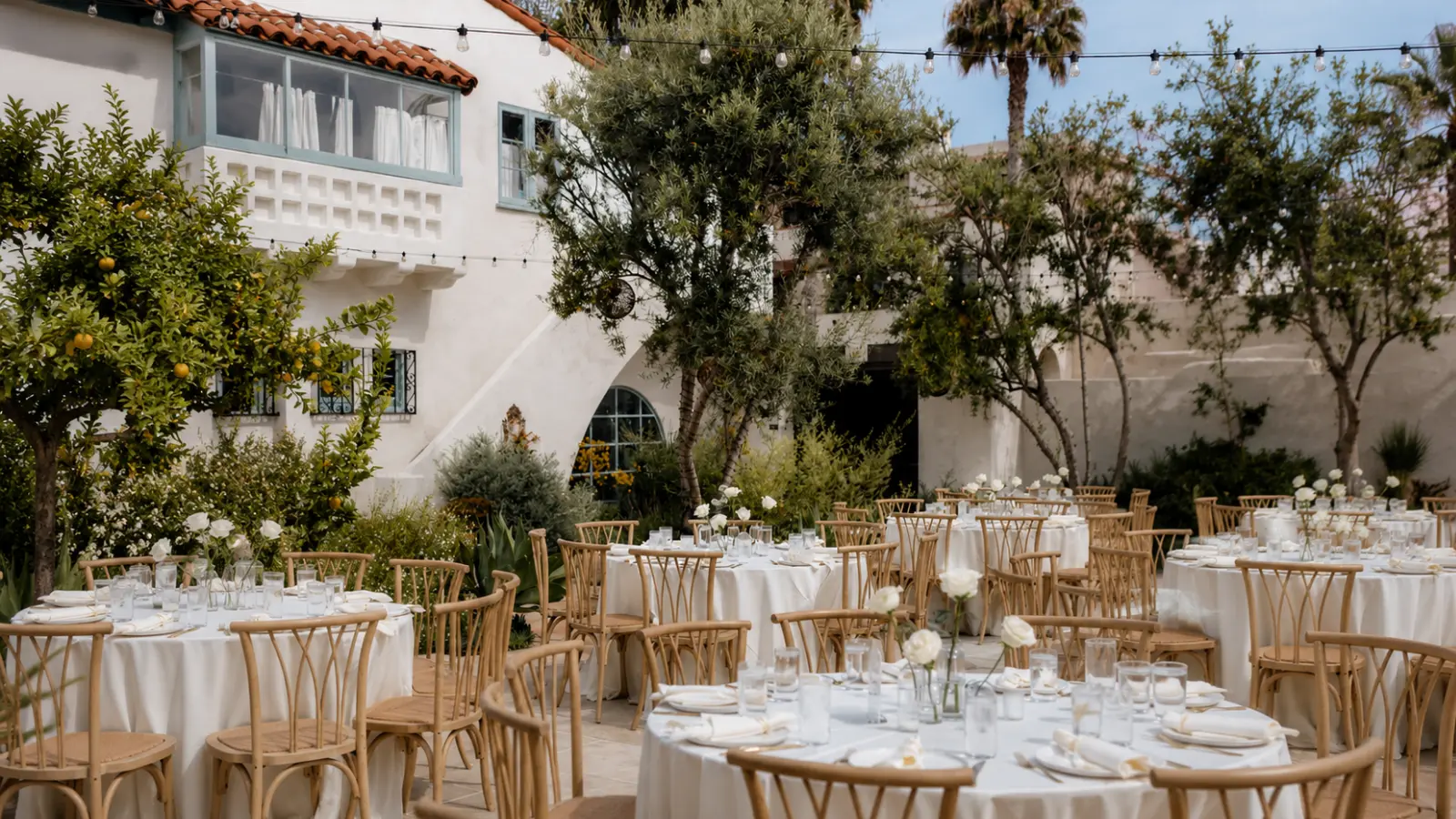 Wedding Seating Chart shown through an outdoor reception with multiple tables and chairs arranged for organized and comfortable guest seating Wedding Seating Chart: How to Seat Guests Without the Stress