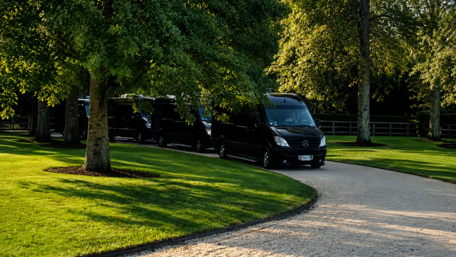 Wedding shuttle vans arriving at a venue as part of an organized transportation plan for guests Wedding Transportation Plan: Getting Every Group Where They Need to Be