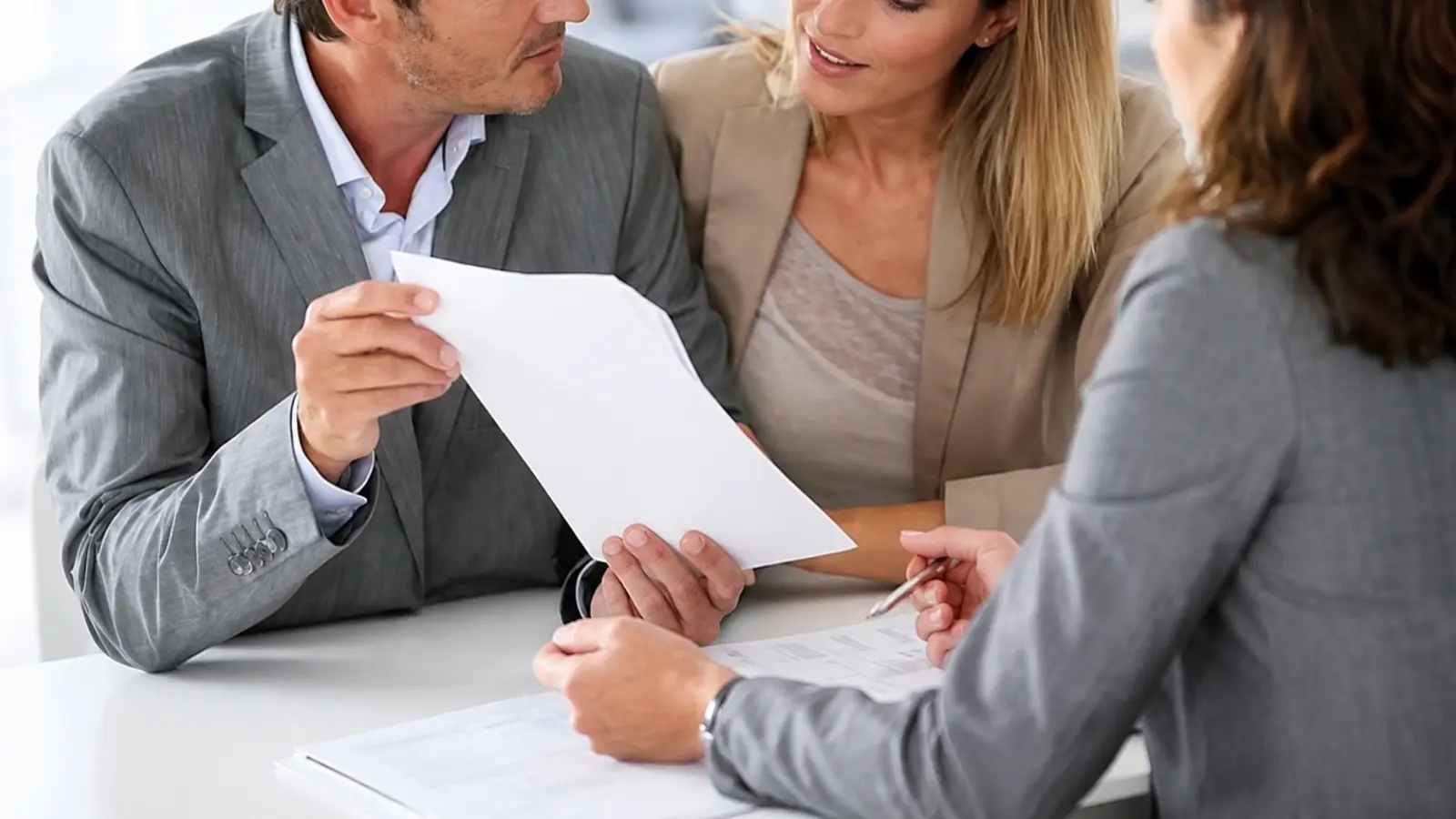 Wedding Vendor Contracts being reviewed by an engaged couple with a professional before signing the final agreement Wedding Vendor Contracts: What to Check Before Signing