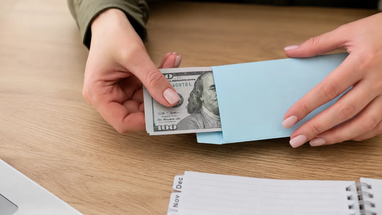 Wedding Vendor Tipping Guide showing cash being placed into an envelope to prepare gratuities for wedding vendors Wedding Vendor Tipping Guide: Who to Tip, When and What to Check