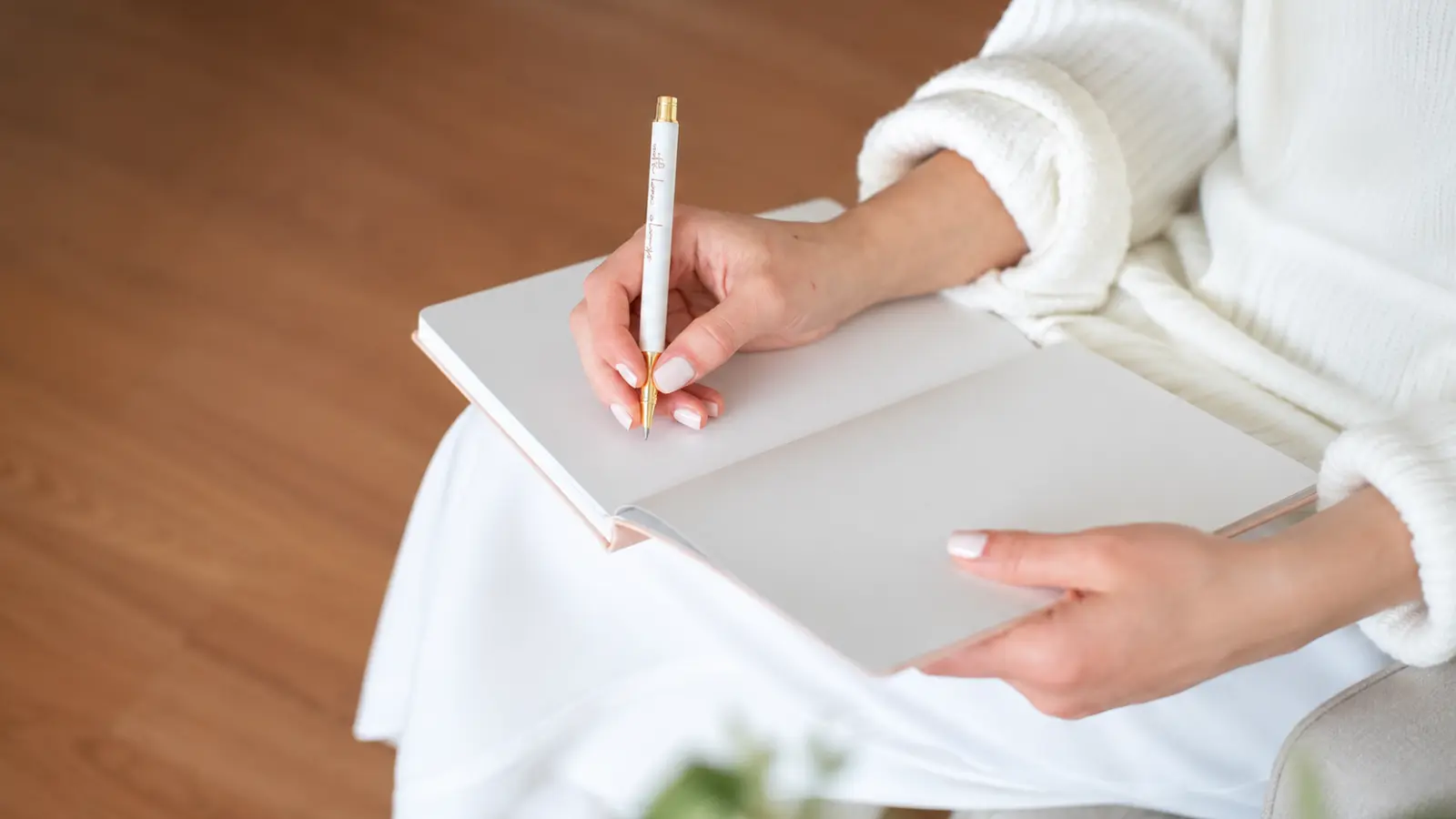 Who to Invite to Your Wedding represented by a bride writing a guest list and deciding which family members, friends and other guests to include Who to Invite to Your Wedding: A Practical Guest List Framework